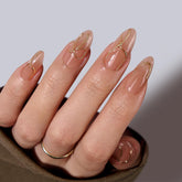BTArtbox Radiant Ribbons almond nails with 3D gold lines for a luxe manicure vibe