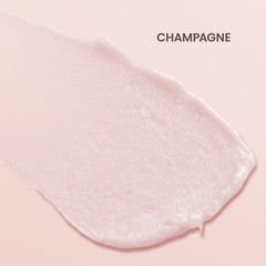 Burt's Bees Shimmer Lip Tint Champagne swatch on skin shows soft glow.