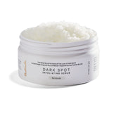 Bushbalm Bermuda dark-spot exfoliating scrub bottle shows pre-shave prep and buffing action.