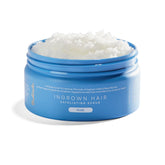 Bushbalm Nude Scrub packaging front highlights vegan formula for prepping skin before shaving.
