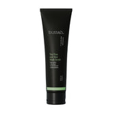 Buttah Tea Tree Aloe Exfoliating Scrub jar demonstrates gentle exfoliation for clearer, oil-balanced skin.