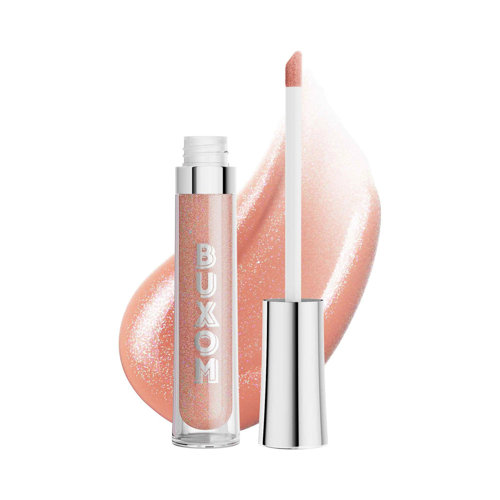 Buxom Celeste lip polish close-up on tube shows high-shine finish and plumping effect.
