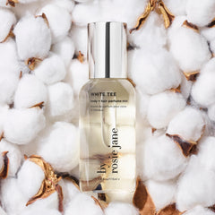 By Rosie Jane bottle with cotton blossom note swirls, soft floral vibe.