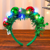 CAKURE LED Christmas headband with green glow for party-ready styling.
