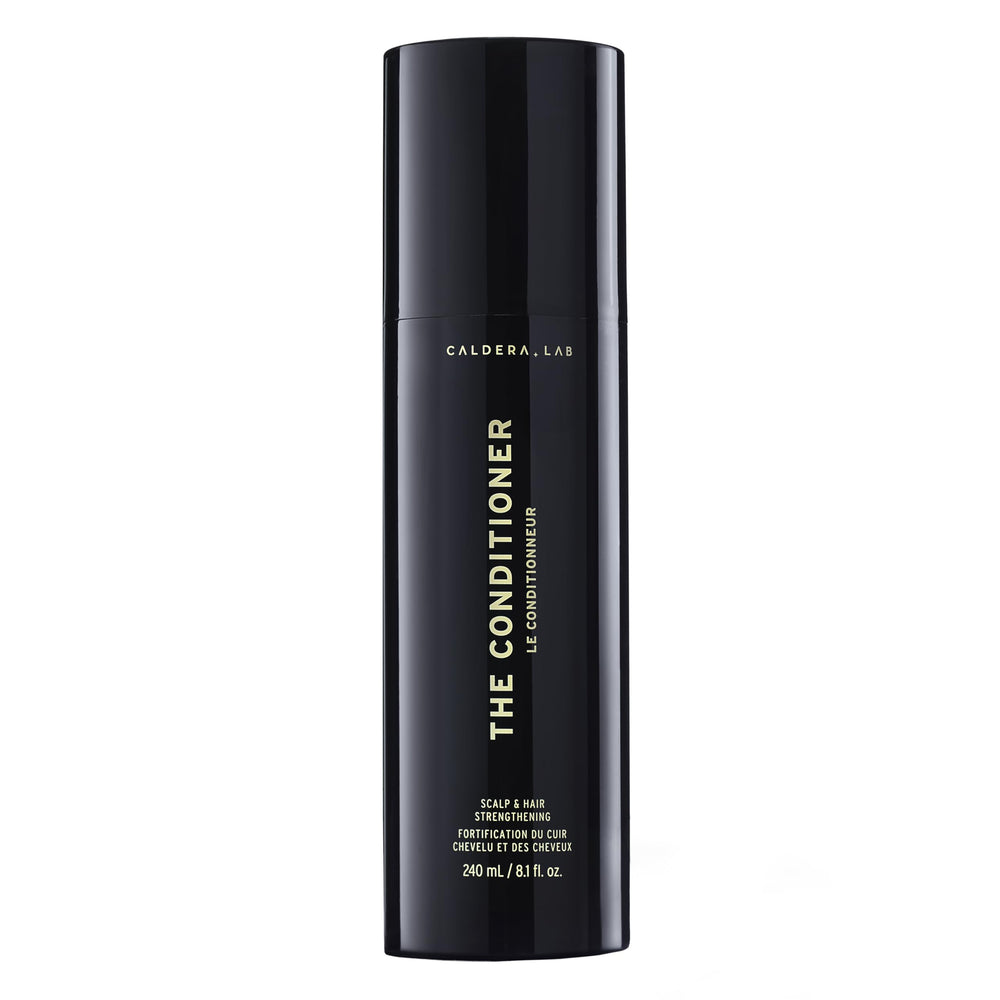 Caldera + Lab conditioner bottle closeup, showcasing hydrating formula for softer, shinier hair.