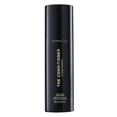 Caldera + Lab conditioner bottle closeup, showcasing hydrating formula for softer, shinier hair.