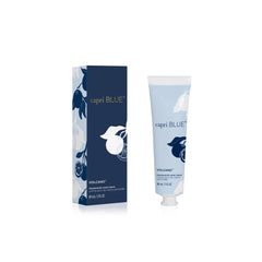 Capri Blue Volcano Flora Edit hand cream tube in blue packaging for on-the-go moisture.