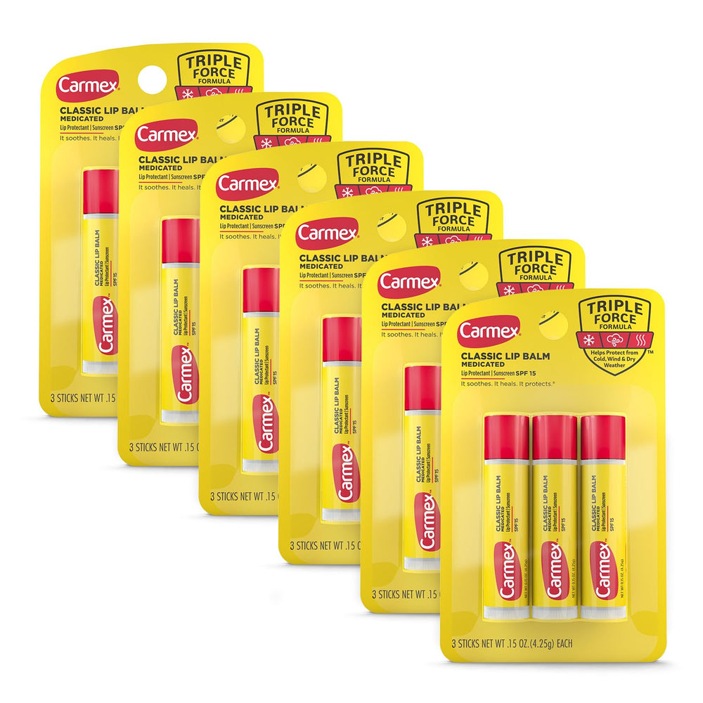 Carmex Classic Medicated Lip Balm Stick being applied for soothing relief on lips.