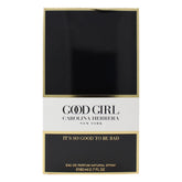 Carolina Herrera Good Girl bottle top gleams, signaling evening glamour and confidence.