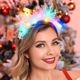 Catery light-up snowflake headband glowing for festive celebrations and photos.