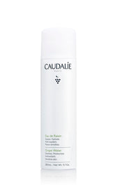 Caudalie grape water face mist bottle delivers refreshing hydration throughout the day.