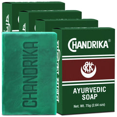 Chandrika Ayurvedic Soap bar unwrap reveals natural ingredients for daily cleansing.