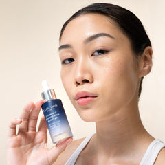Clean Skin Club brightening serum dropper image illustrating precise daily use for radiant skin.