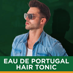 Clubman Pinaud Eau de Portugal splash bottle in hand for on-the-go refreshment