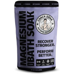 Coach Soak Recovery Bath Soak bottle pouring for a calming lavender bath.