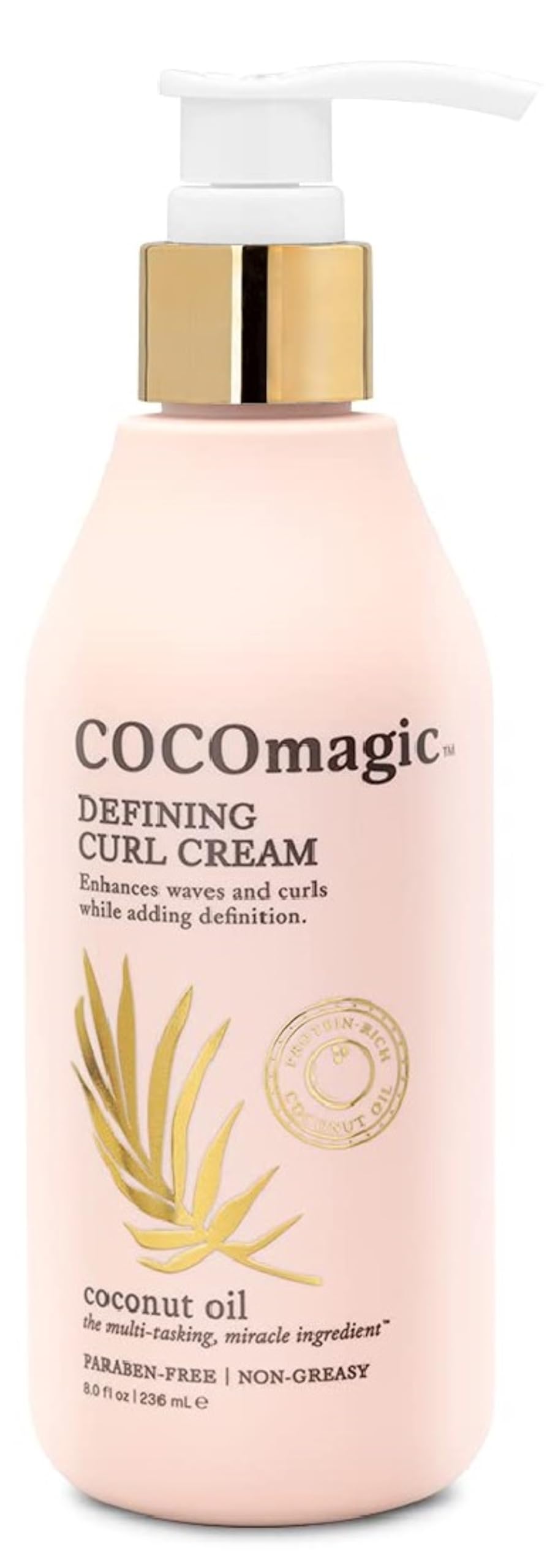 Cocomagic Defining Curl Cream bottle highlights hydrating formula for frizz control.