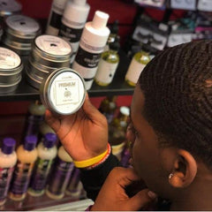 ColdLabel Wolfin Pomade in hand styling a sleek wave