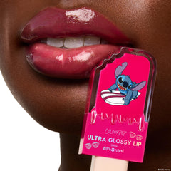ColourPop Stitch lip gloss in sheer hot pink on lips with shine.