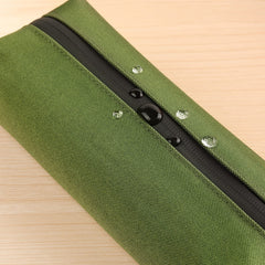 Comfyable mini Dopp kit bag opened demonstrates space for longer items.