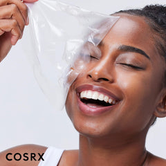 CosRX Advanced Snail Mucin Glass Glow Hydrogel Mask applied on face delivers hydrating glow.