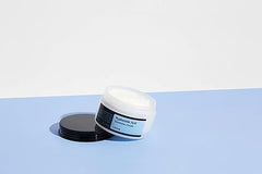 COSRX Hyaluronic Acid Moisturizing Cream texture swatch showing thick, creamy consistency.
