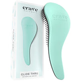 Crave Naturals Biggie Glide Thru brush detangling dry hair for easy styling.