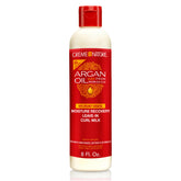 Creme of Nature Moisture Recovery Leave-In Curl Milk bottle pour highlights easy, lightweight hydration