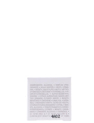 Cristian Dior J'adore mini bottle applied on wrist showcases elegant fragrance.