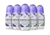 Crystal Essence CRYSTAL deodorant roll-on bottle shows mineral barrier for odor control.