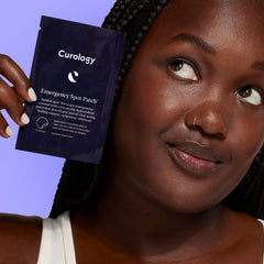 Curology patches adhered to a pimple absorb oil and conceal the spot