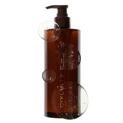 CYKLAR Sensorial Body Wash Sacred Santal bottle in warm bath scene highlighting hydrating cleanse