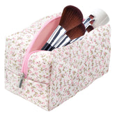 Dark Swan cotton quilted makeup bag with pink floral pattern, stylish travel companion.