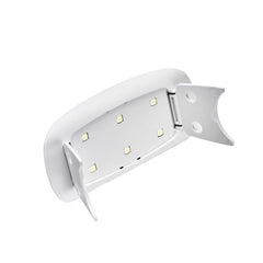 Dashing Diva Mini LED Gel Nail Lamp USB cord for easy setup.