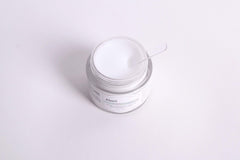 Application shot of DearKlairs mask showing dual-use as day moisturizer and overnight mask.