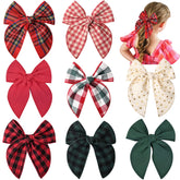 DEEKA dark green bow clip adds festive appeal and secure hold for toddler hair