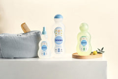 Denenes Baby Cologne packaging box displays 20 oz size and gentle use.