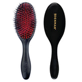 Denman Cushion Hair Brush Small in black close-up for smooth detangling and shine.
