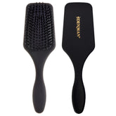 Denman D84 black mini paddle brush top view for portable detangling and styling.