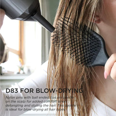 Denman detangling brush bristles ease through wet and dry hair for smoother transitions.