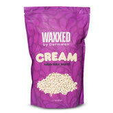 Dermwax WAXXED beads close-up showing creamy application for smooth waxing sessions.