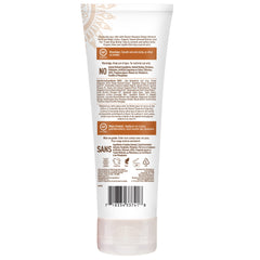 Desert Essence Sweet Almond lotion 8oz bottle cradled in hand for travel-friendly moisture.