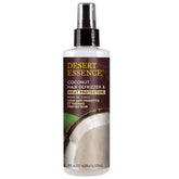 Desert Essence Coconut Defrizzer bottle ready for heat protection during styling.
