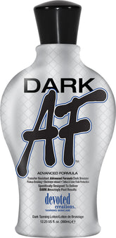Devoted Creations Dark AF bottle applying transfer-resistant bronzer for deep bronze color.