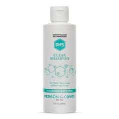 DHS Clear Shampoo bottle closeup showing unscented formula for sensitive skin.