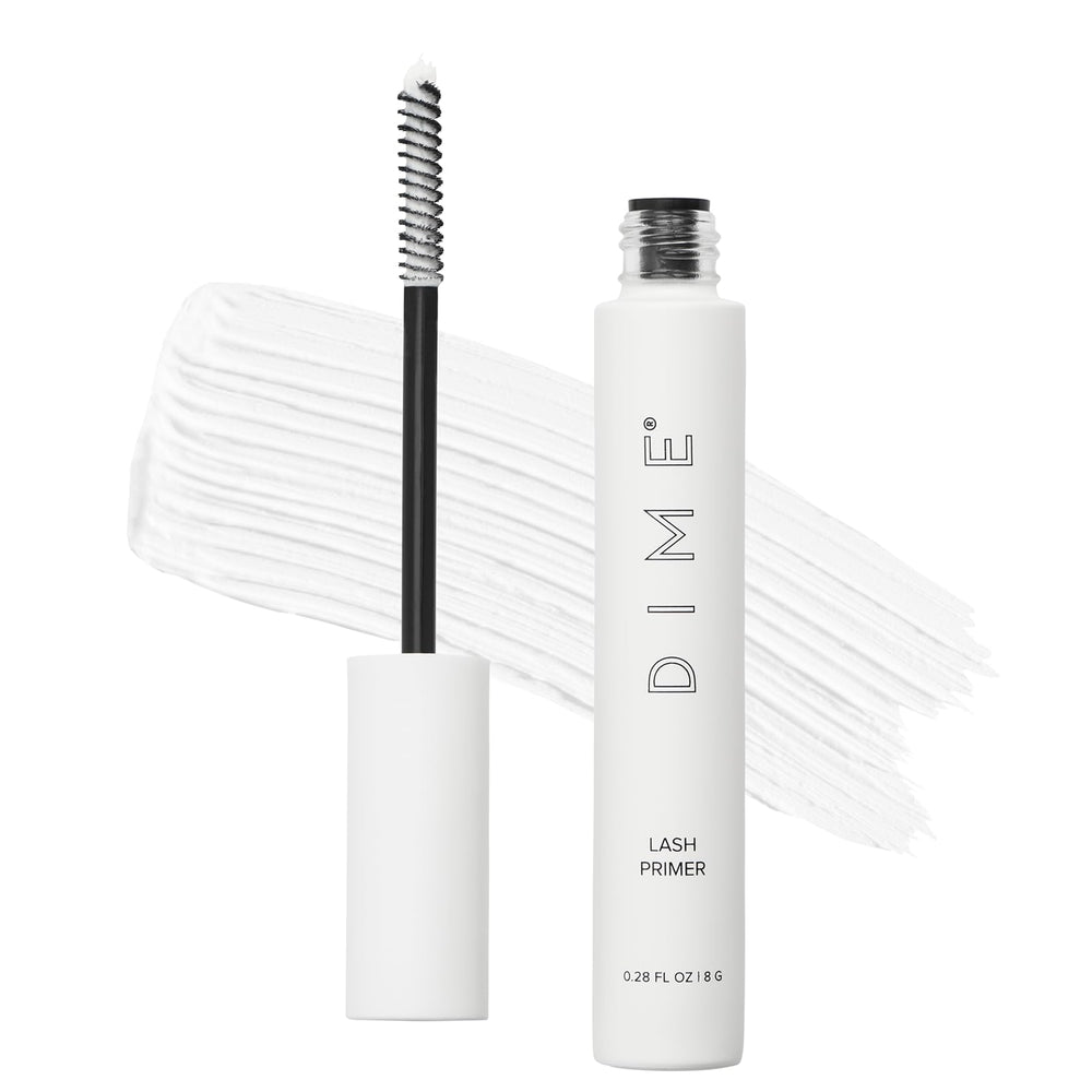 DIME Beauty Lash Primer jar close-up showing white formula for even lash coating