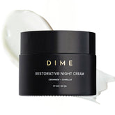 DIME Beauty Restorative Night Cream pump close-up showing silky texture for overnight hydration.