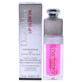 Dior Addict Lip Glow Oil raspberry bottle showcases glossy finish, enhancing natural color.
