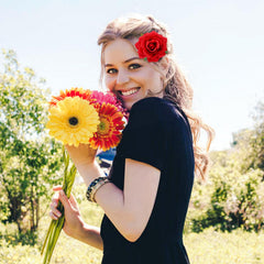 Dizila rose brooch doubles as a clip for versatile event styling.