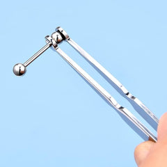 DJCIW piercing clamp in use enabling precise placement of nose or cartilage jewelry.