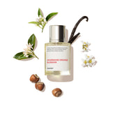Dossier Gourmand Orange Blossom bottle close-up showcasing the premium golden hue for daily luxury.
